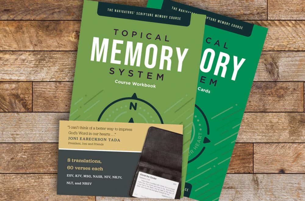 Picture of the Topical Memory System (scripture memorization resource) on a wooden desk